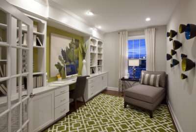 Fabulous flex space with built-ins, desk and seating area. Accented with blue and green.