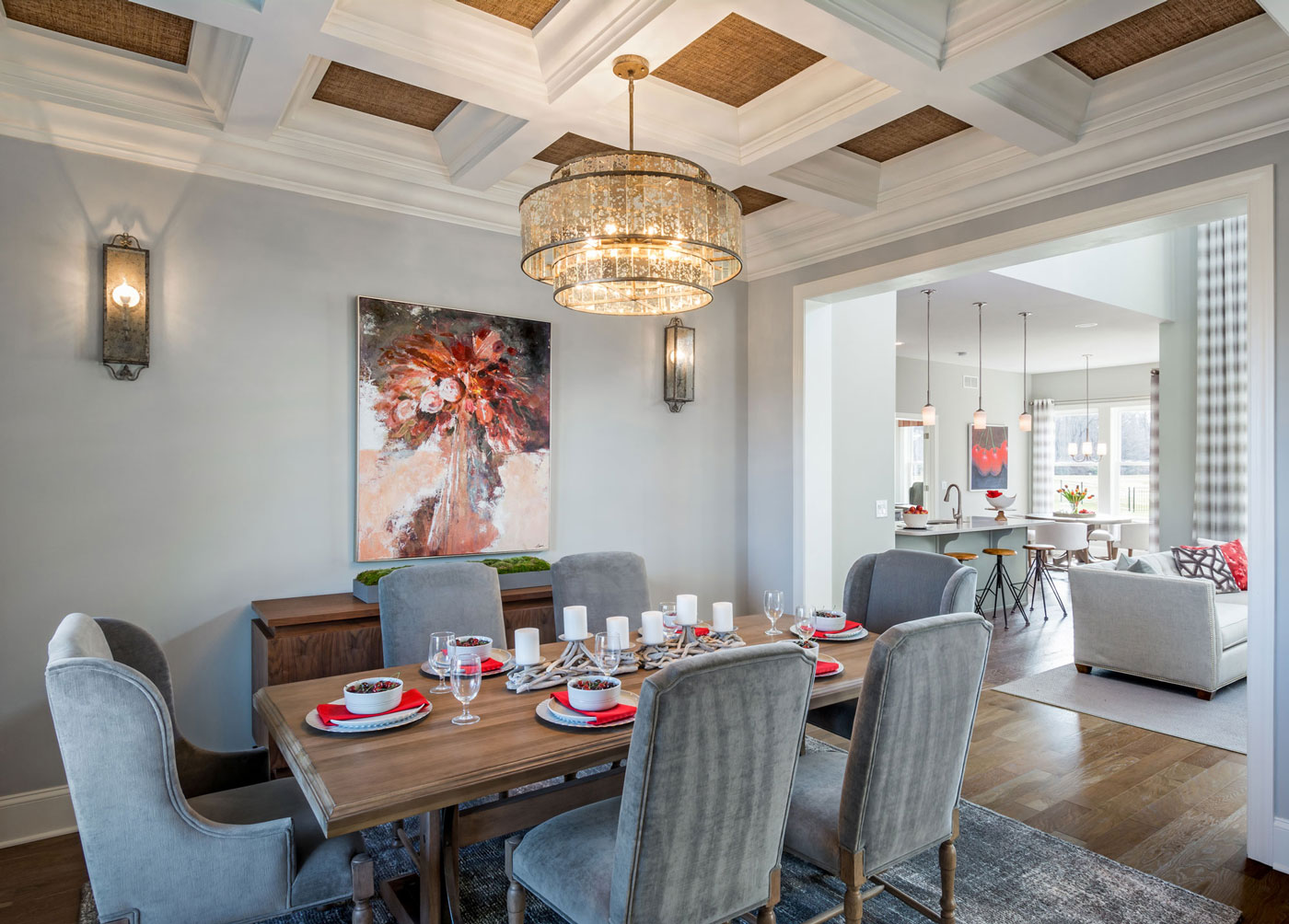 Elegant dining area in model home with dramatic coffered ceiling and open floor plan designed for 55+ home buyer in Delaware.