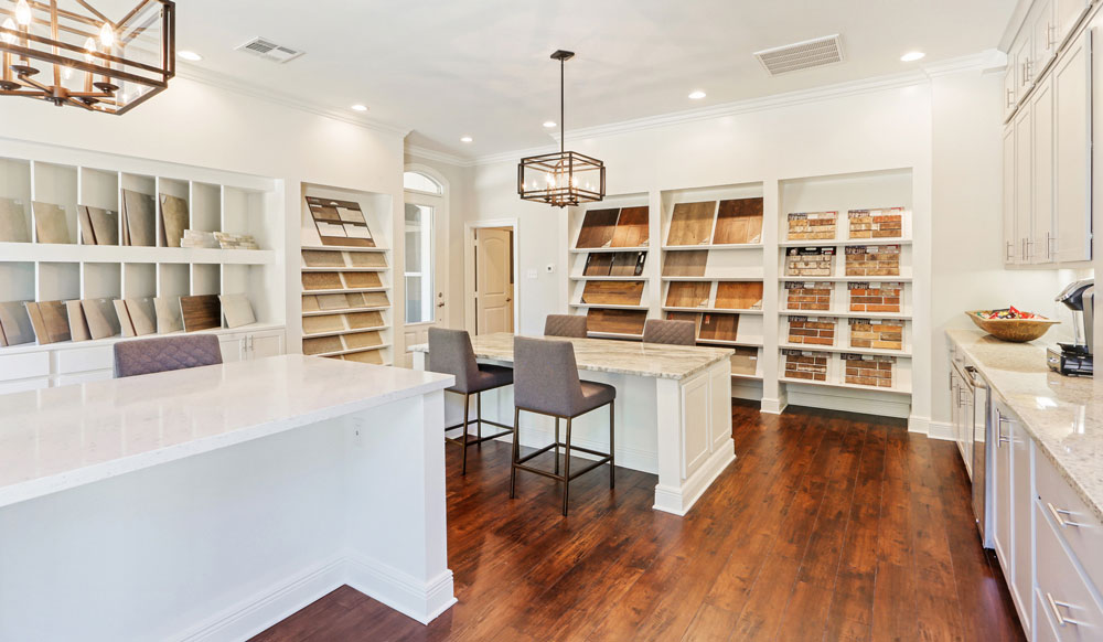 Louisiana design center within model home merchandised white finishes and samples organized throughout the space.