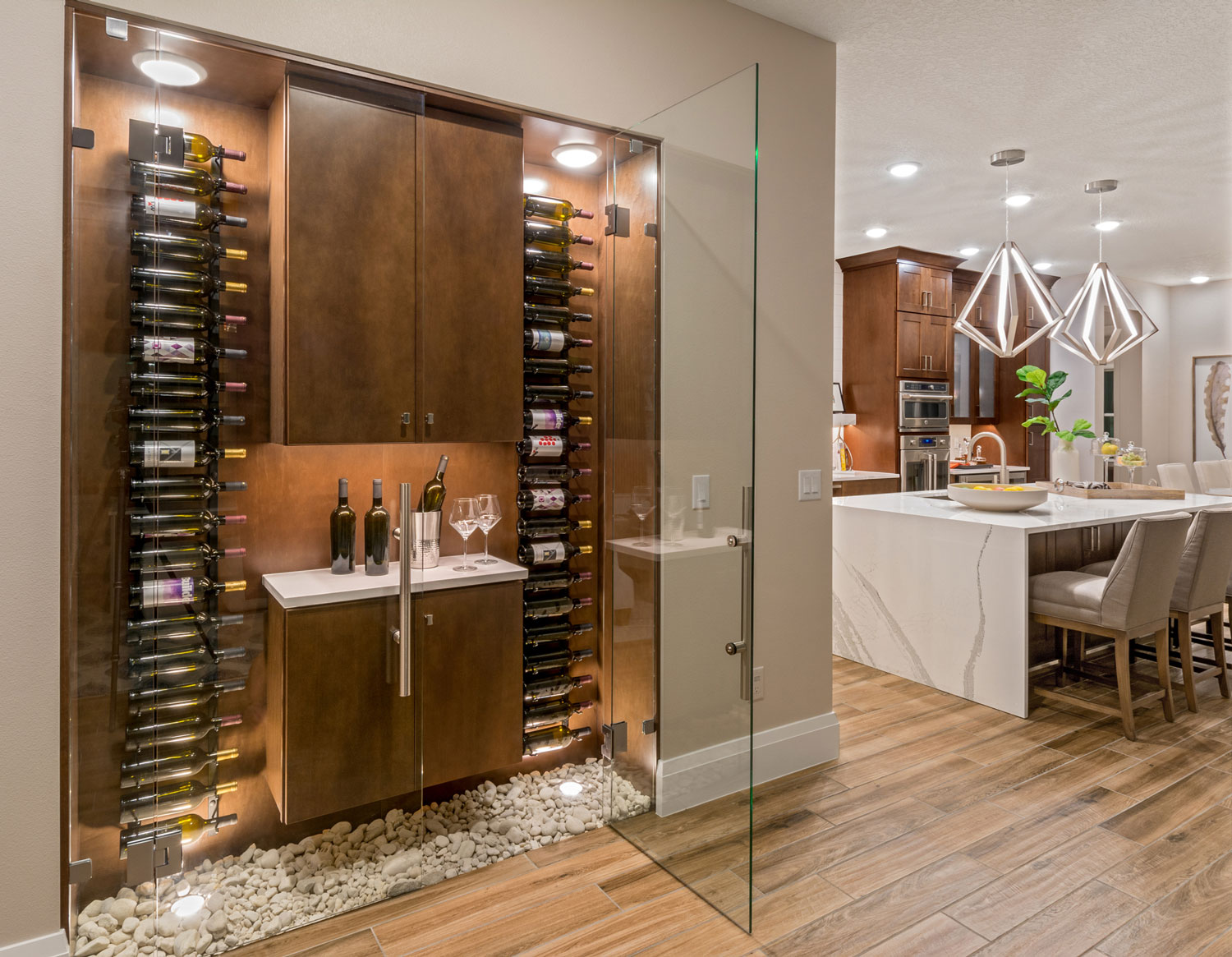 Creative wine storage in wall nook off kitchen in award-winning 55+ home buyer model home in Orlando, Florida.